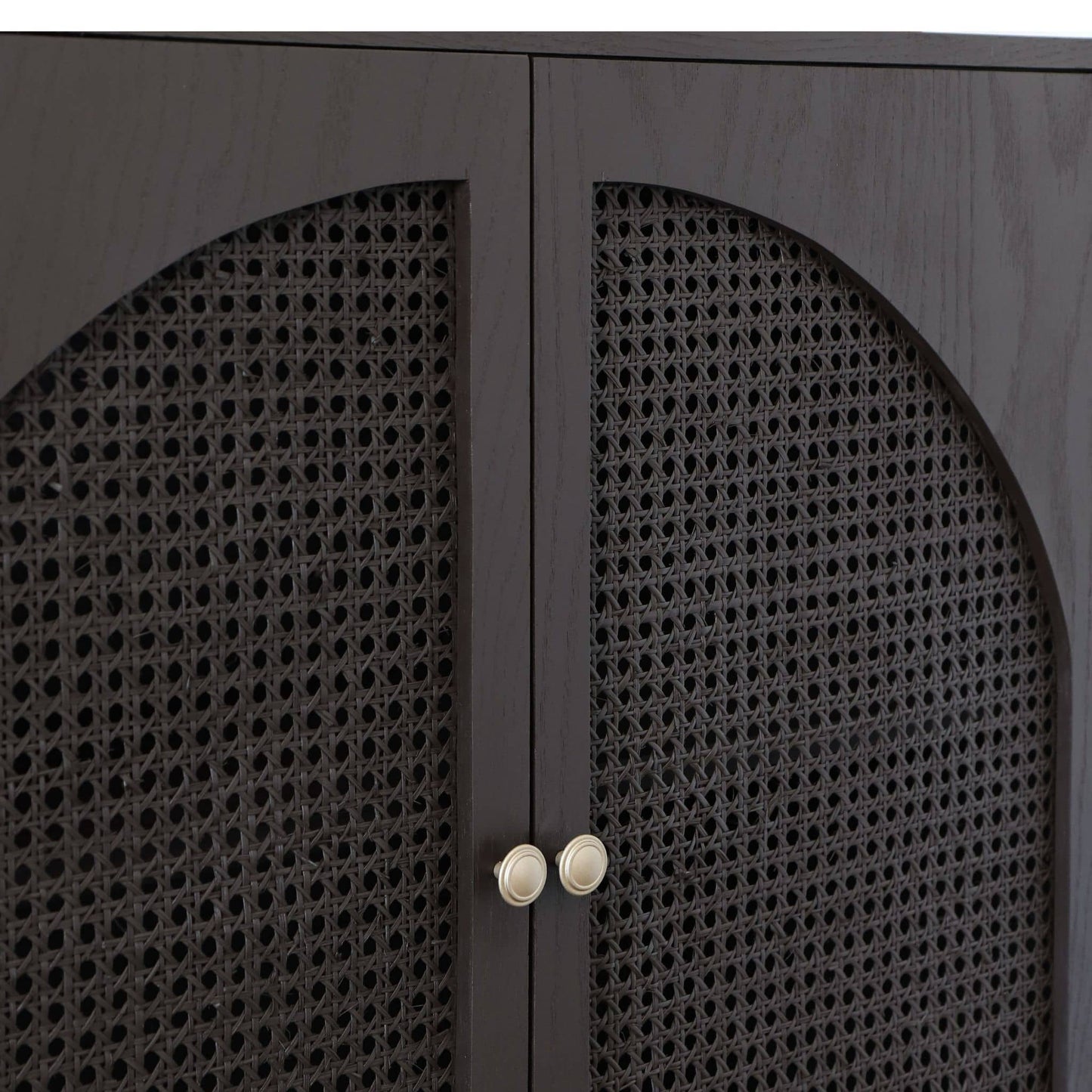 Dark wooden cabinet with cane doors and gold handles