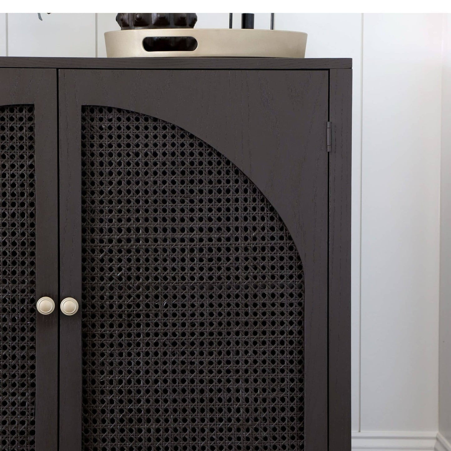 close up of DIY accent cabinet with arched cane doors