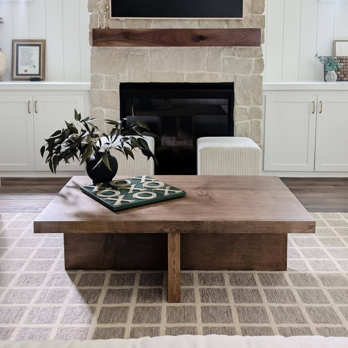 DIY decor coffee table in living room with stone fireplace
