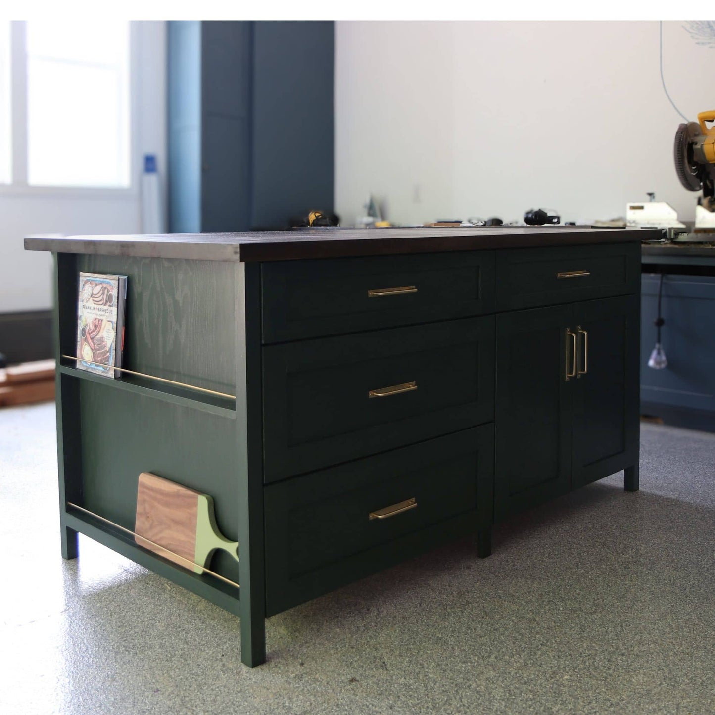 DIY kitchen island with view of drawers, doors, and cookbook display shelves