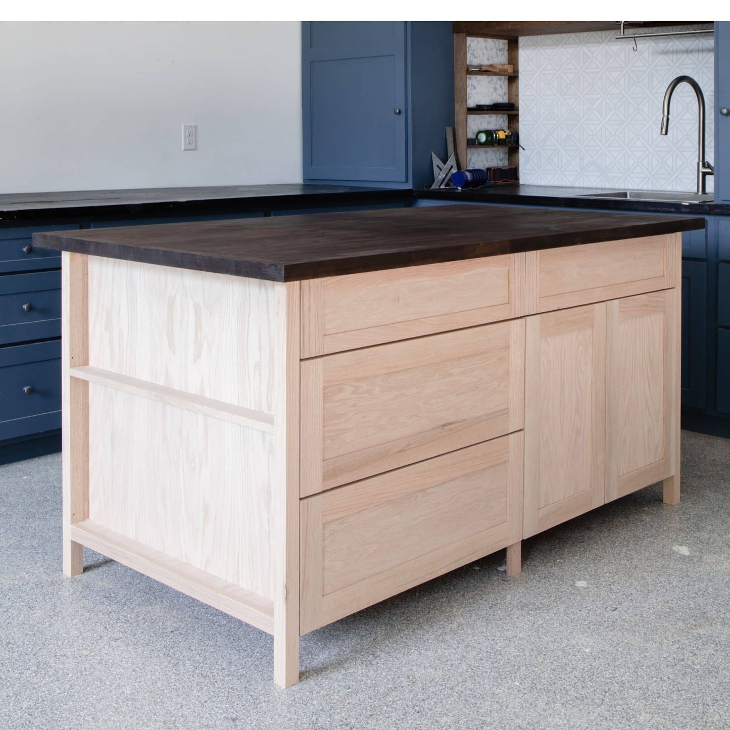 side view of DIY kitchen island with butcher block countertop