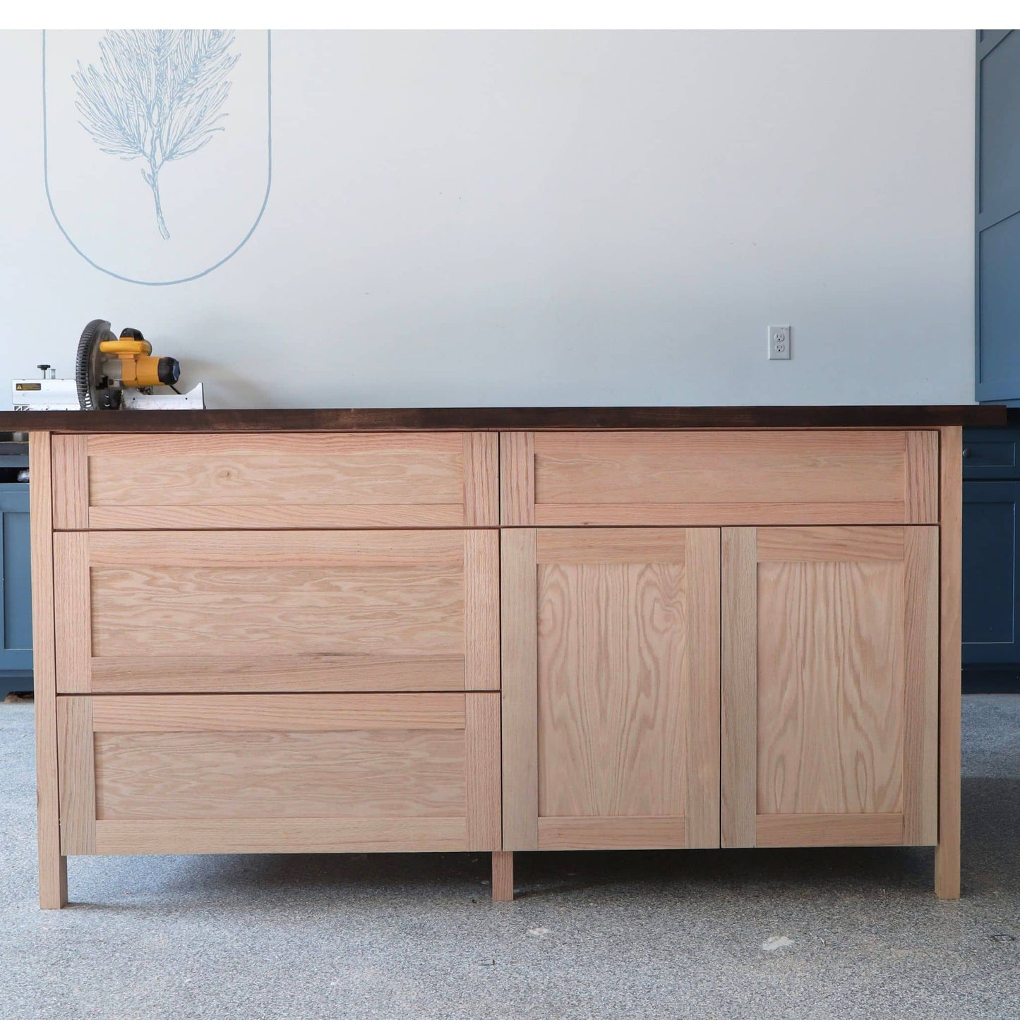 Front side of DIY kitchen island with 4 drawers and 2 doors