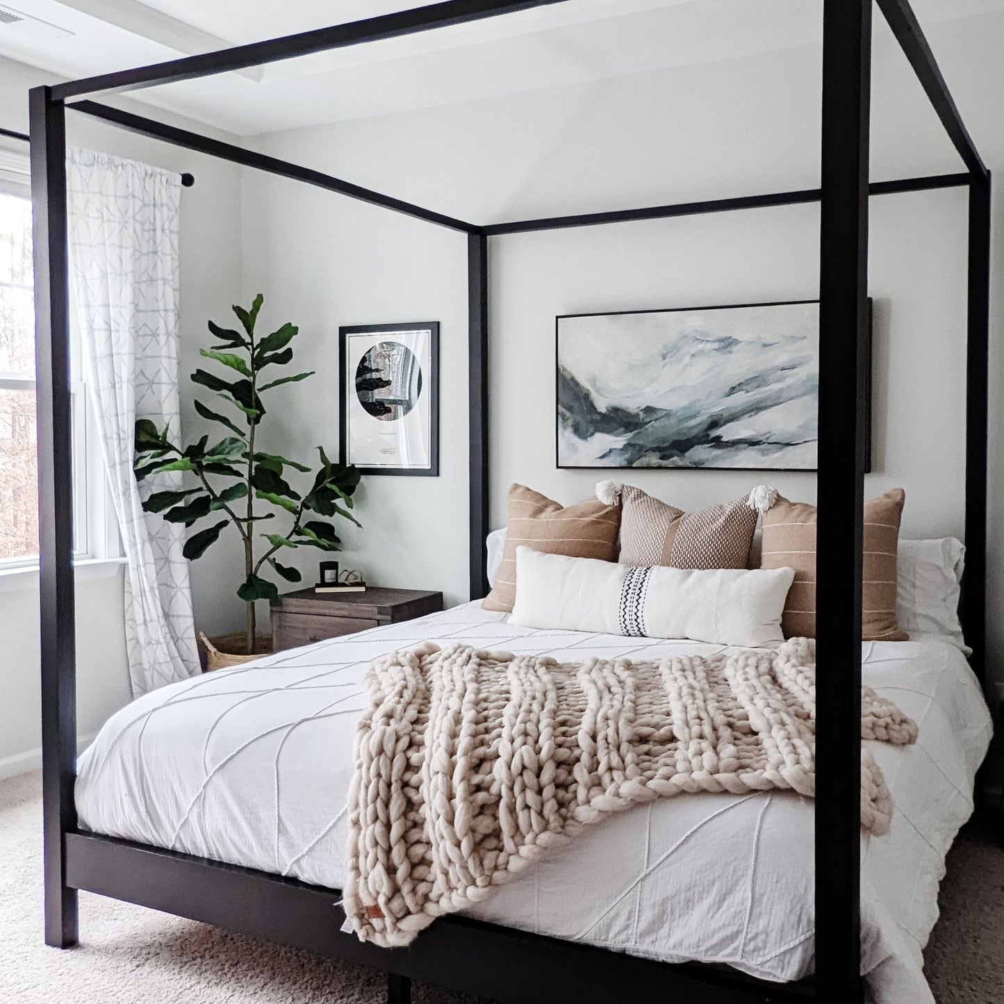 Canopy Bed painted black in a well decorated bedroom