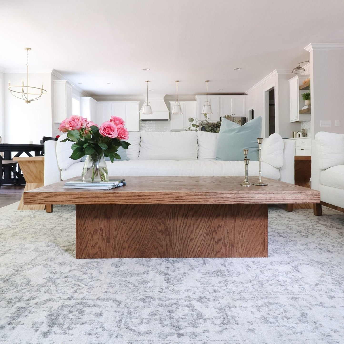 Coffee Table with Storage sitting in a living room in front of a white couch