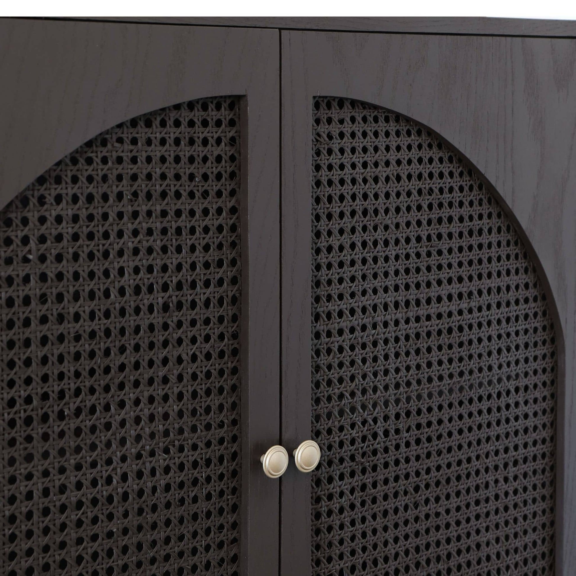 Dark wooden cabinet with cane doors and gold handles