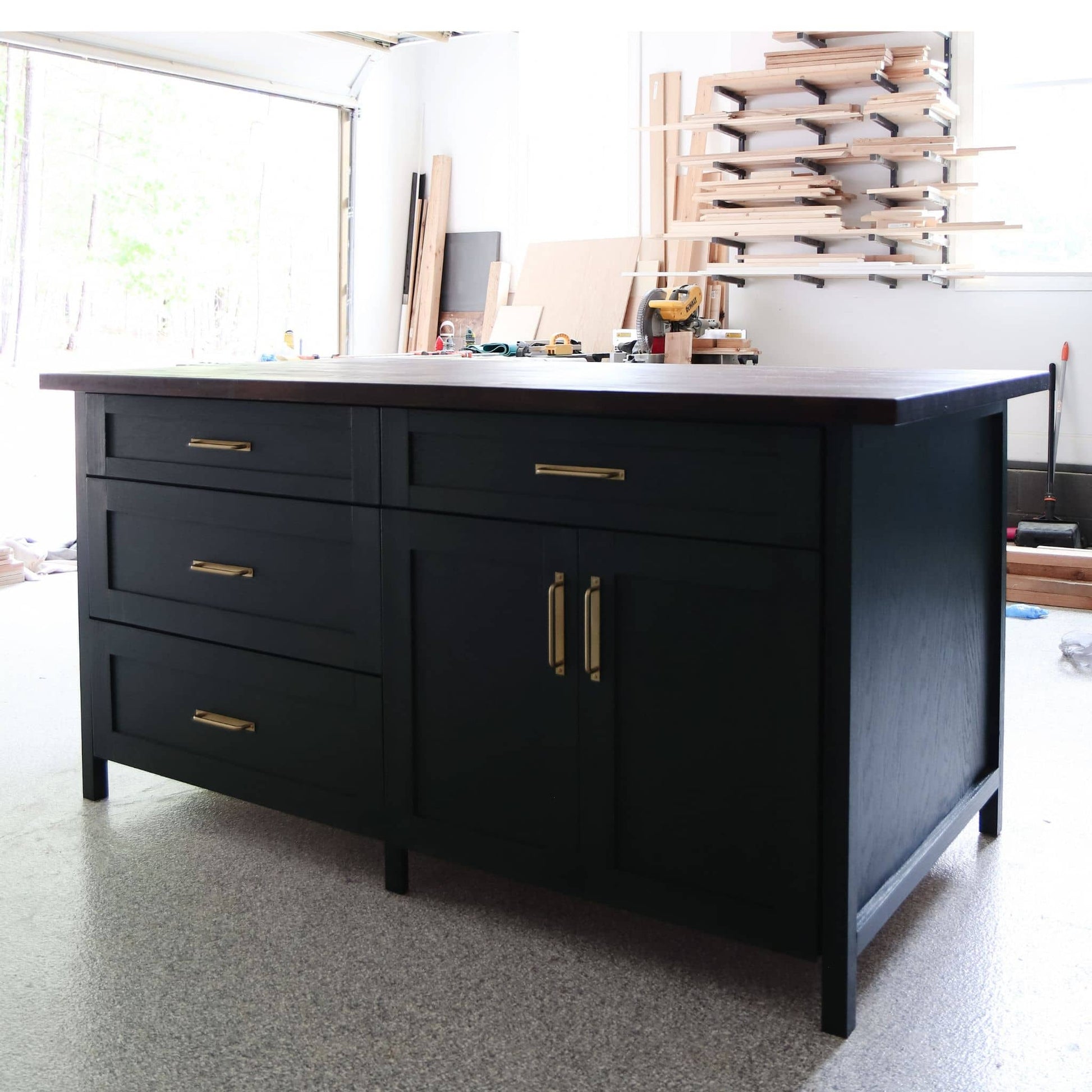 DIY kitchen island with dark finish in garage