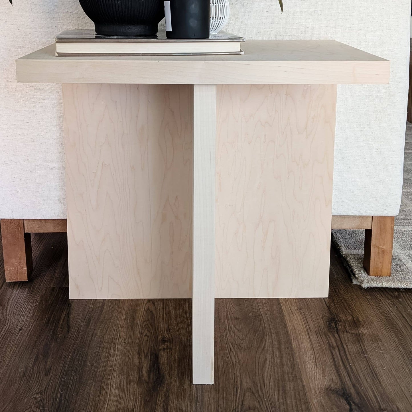 DIY wooden side table up against couch