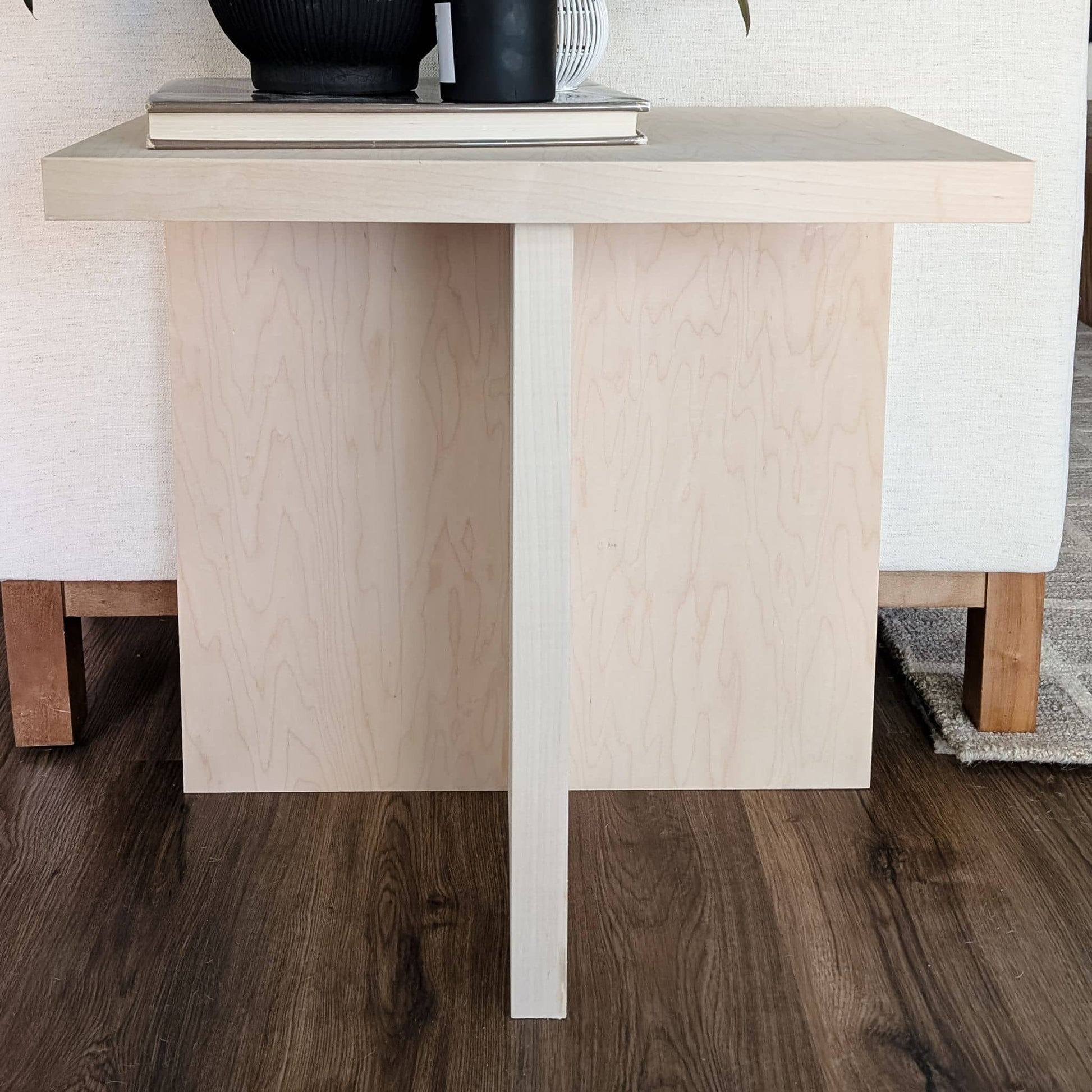 DIY wooden side table up against couch