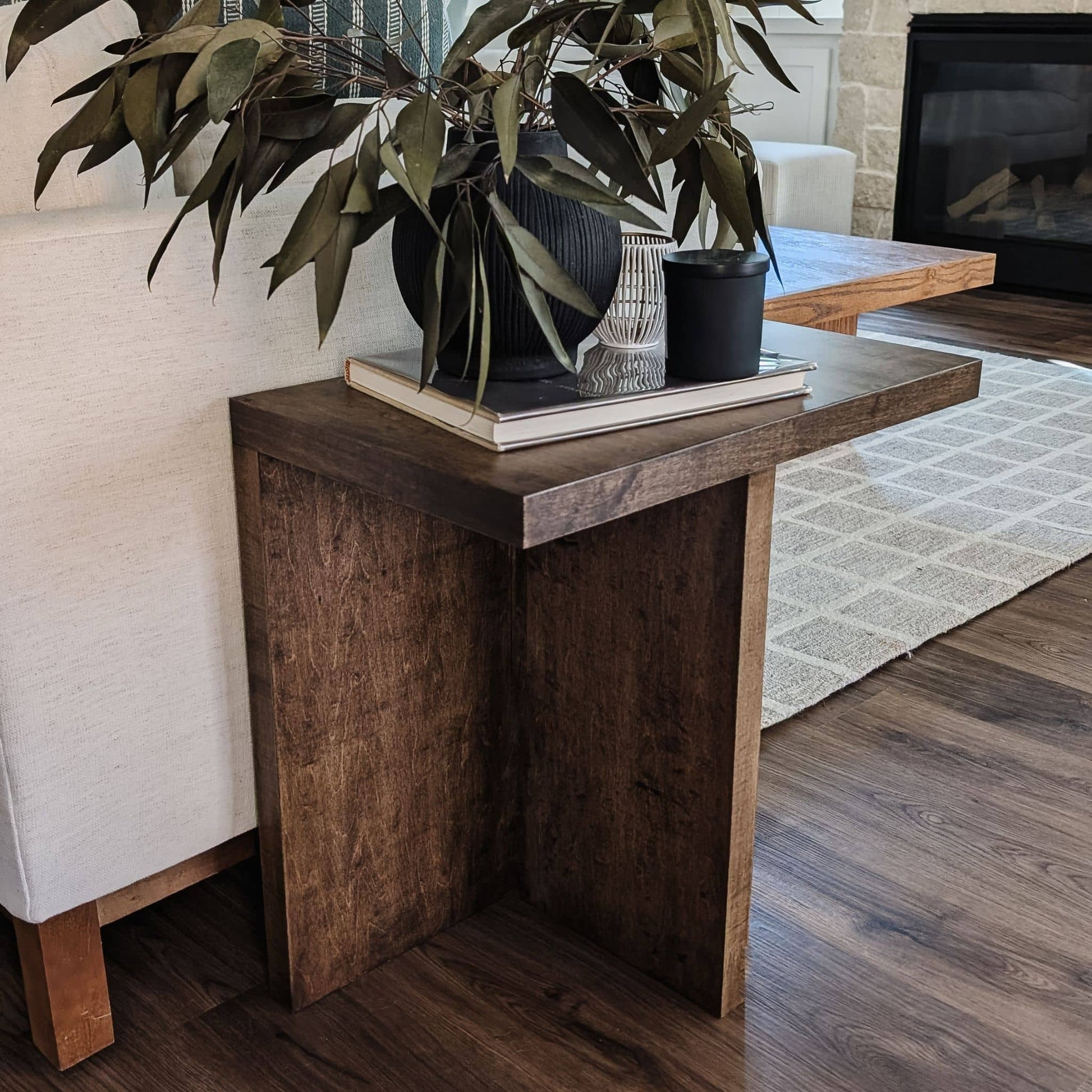 DIY wooden side table pressed up against couch