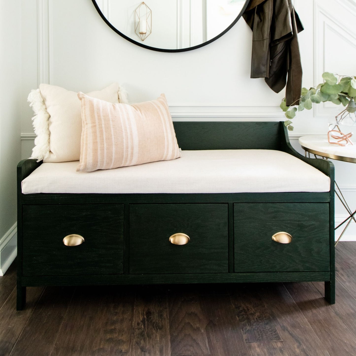 Entryway Bench with Storage stained green styled in a hallway