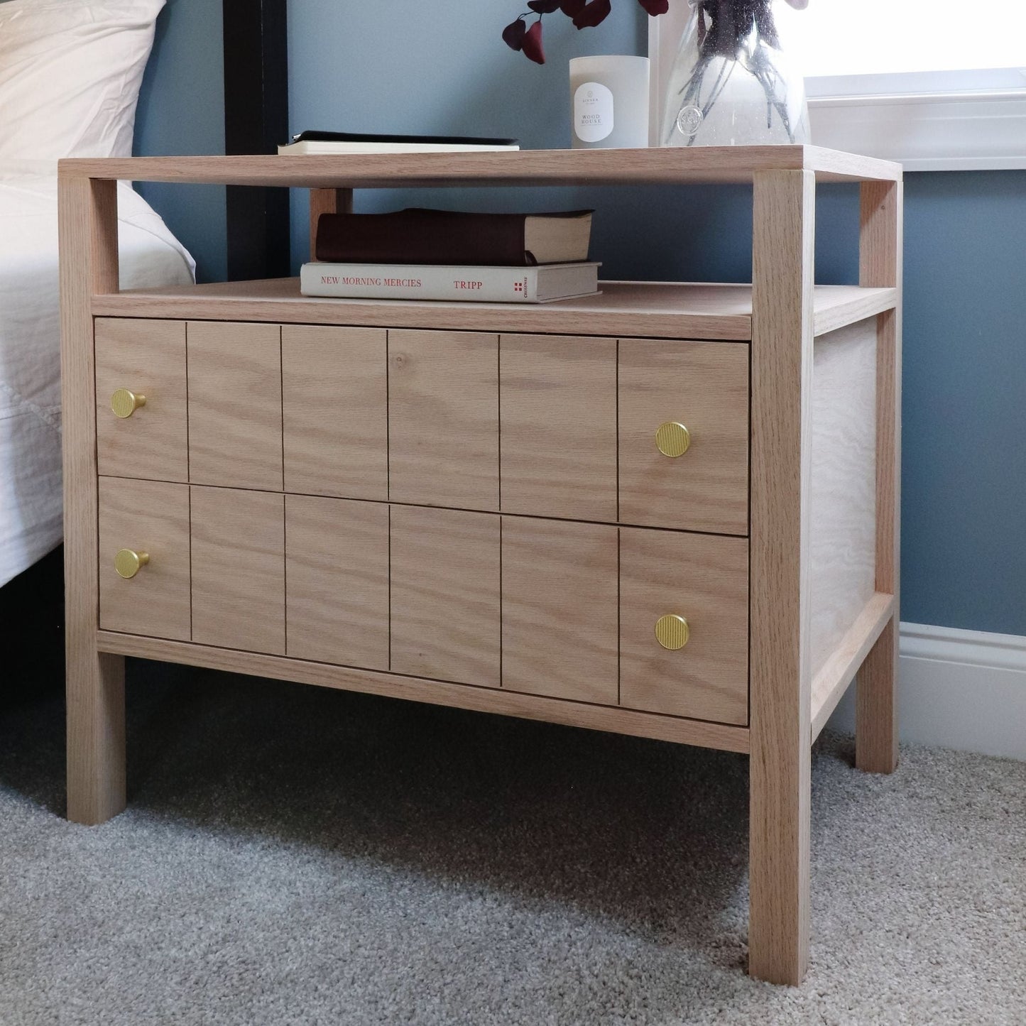 Nightstand styled in a bedroom