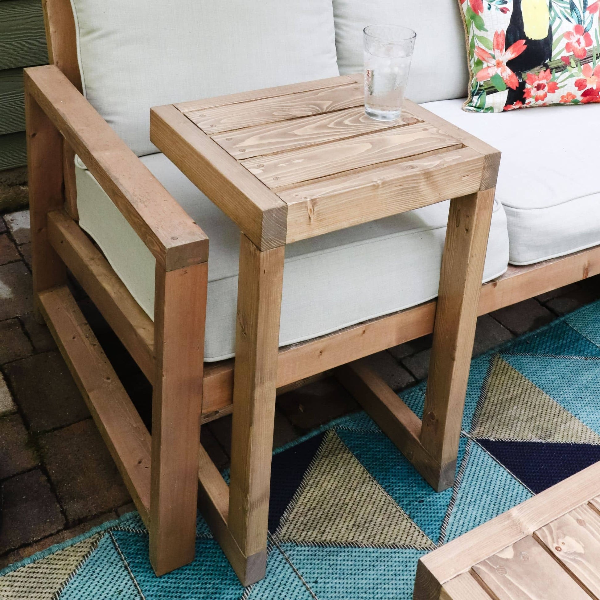 Outdoor C Side Table against a couch