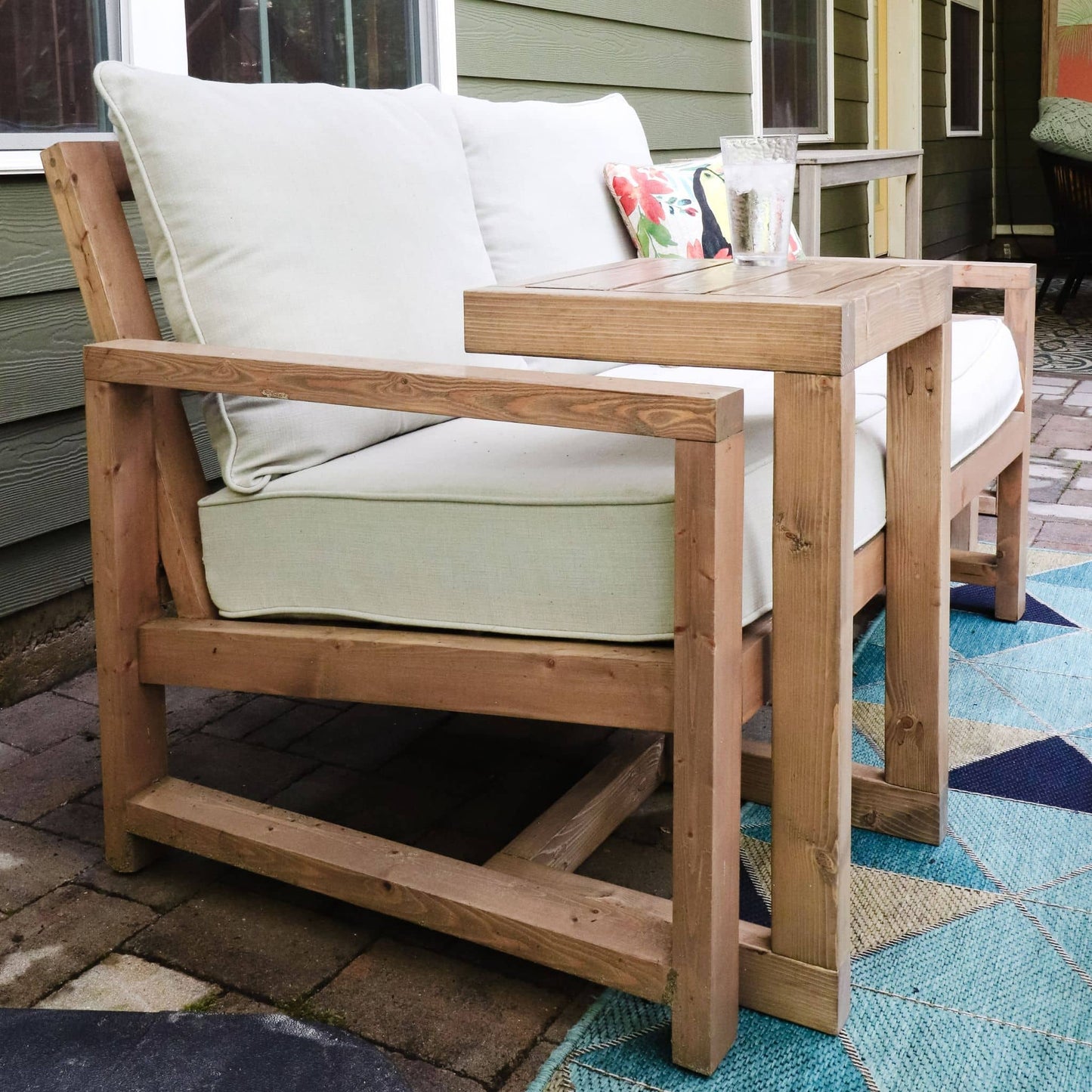 Outdoor C Side Table close up against a couch