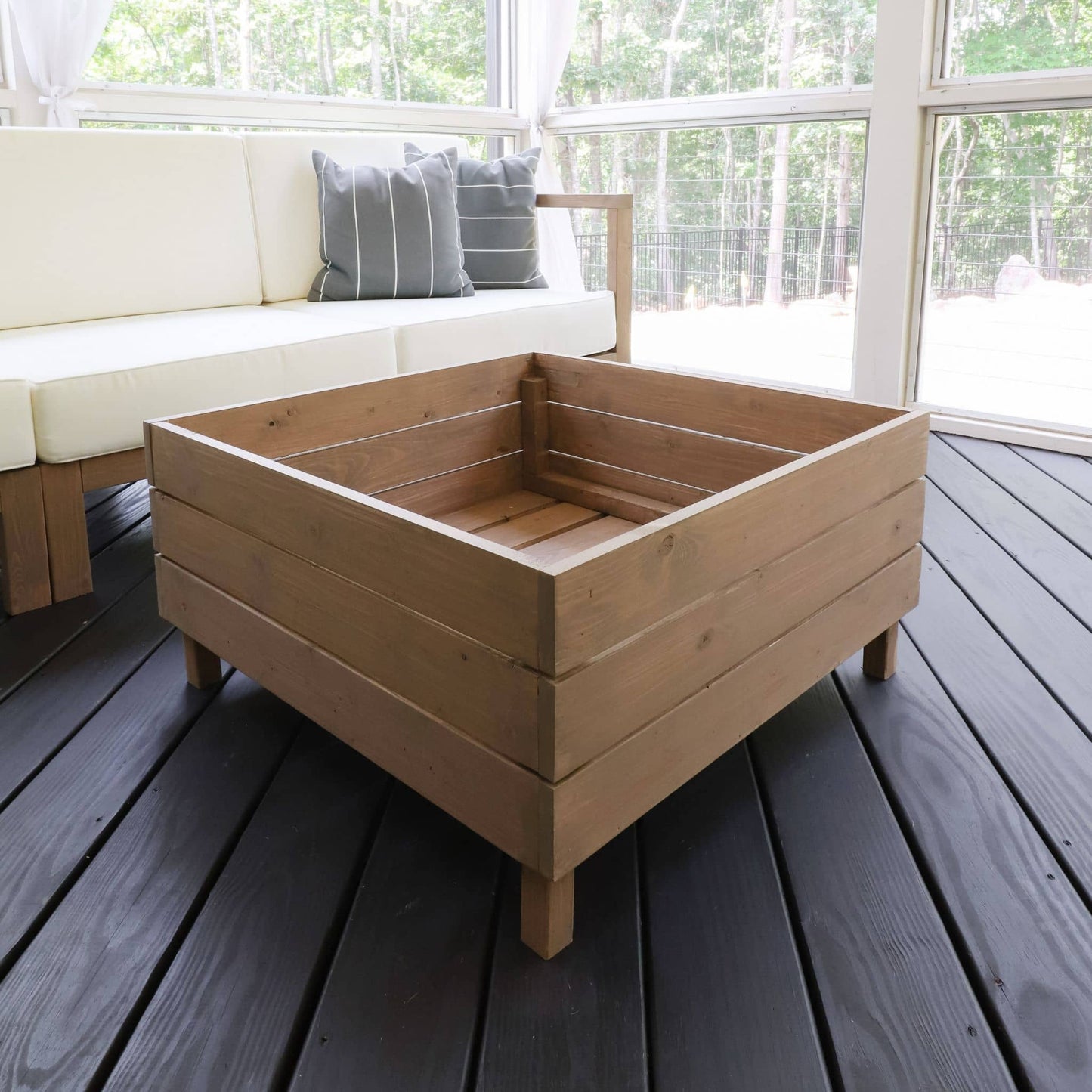 Outdoor Storage Table with lid off on screen porch