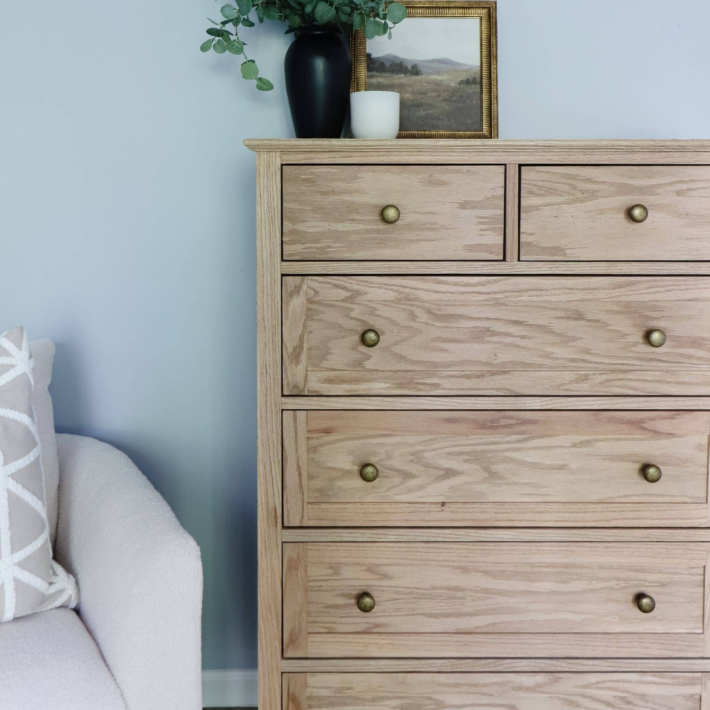 Tall Dresser close up in bedroom with gold knobs