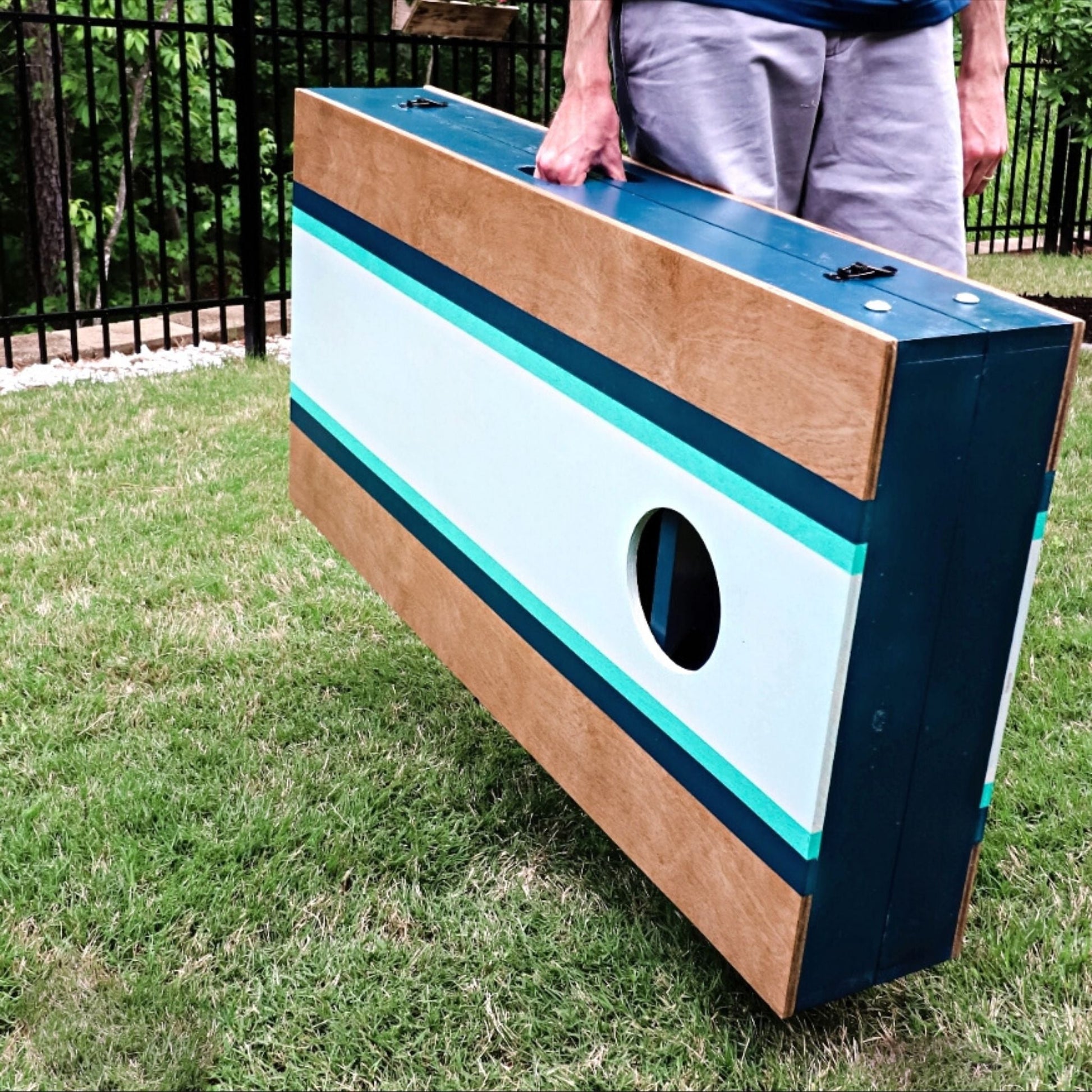 The Ultimate Cornhole Boards with handle attached together