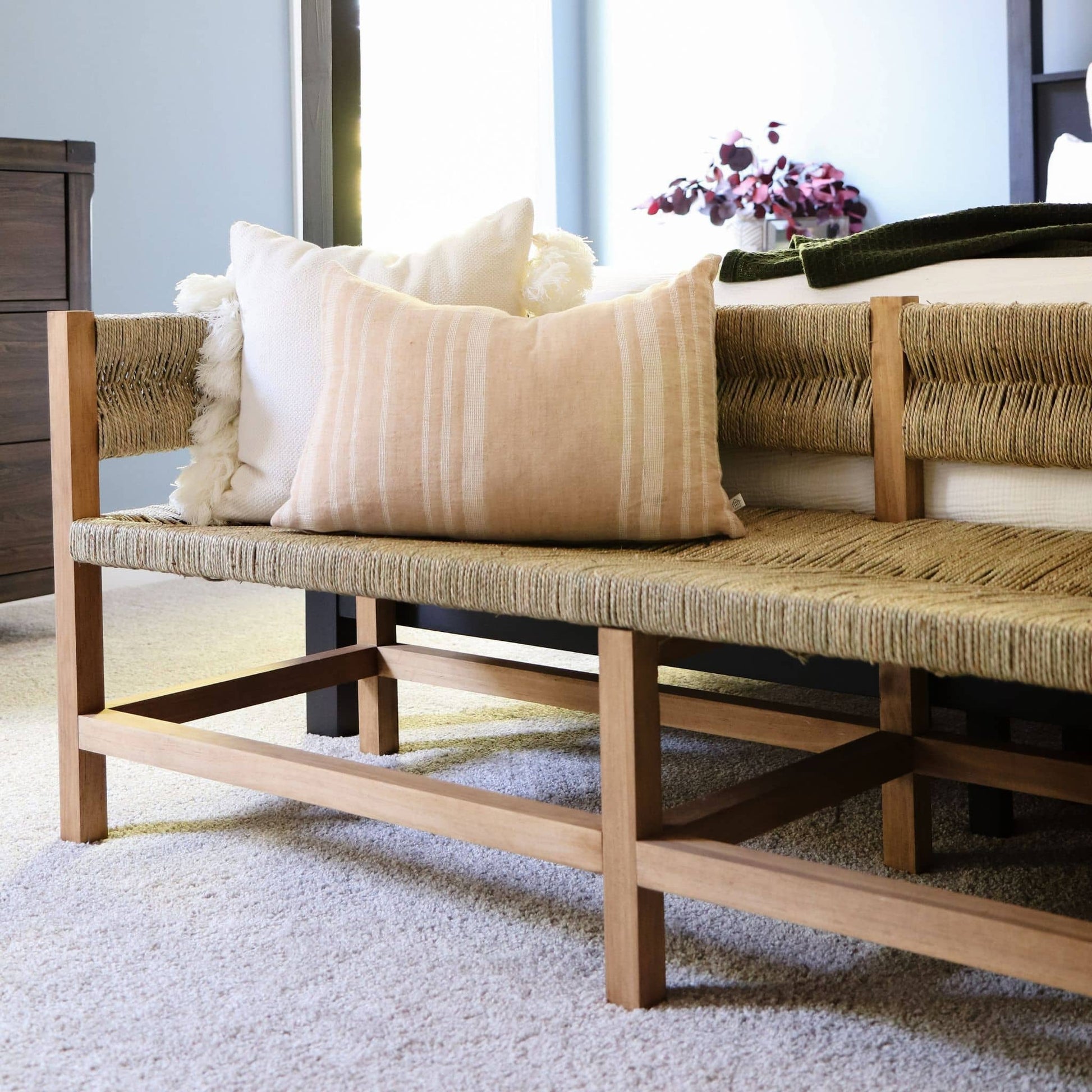 Woven Bench close up with throw pillows