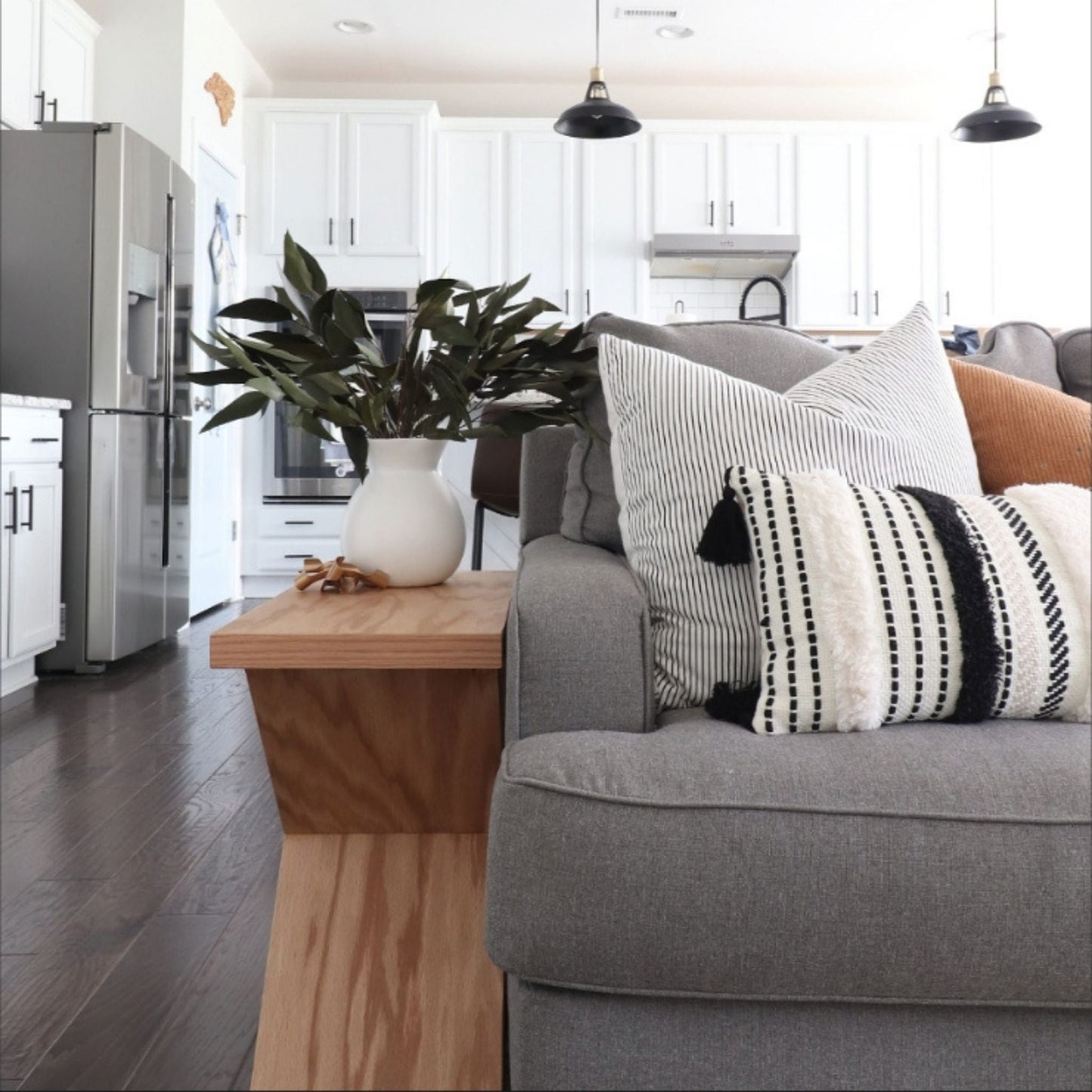 X-Side Table next to a couch in living room